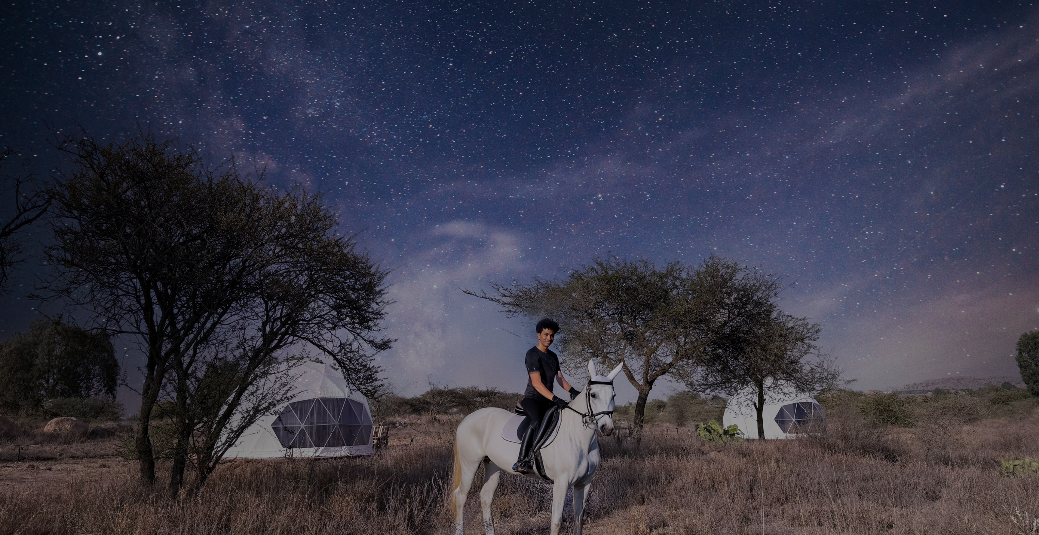 Family adventure with geodesic domes in Saudi Arabia desert landscape